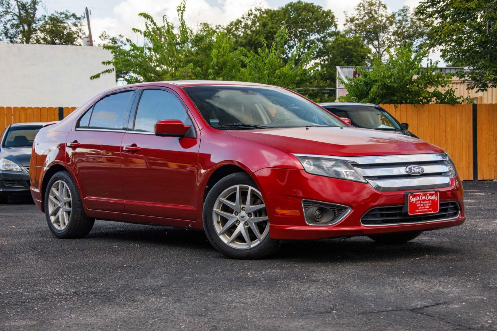 2012 RED FORD FUSION SEL (3FAHP0JA1CR) with an 2.5L L4 DOHC 16V engine, 5-SPEED AUTOMATIC OR 5-SPEED MANUAL transmission, located at 420 E. Kingsbury St., Seguin, TX, 78155, (830) 401-0495, 29.581060, -97.961647 - Photo#0