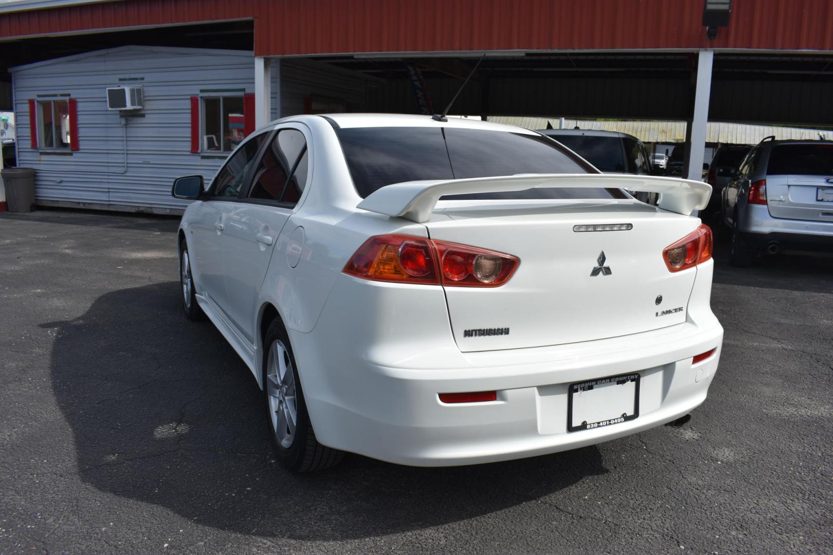 2009 WHITE /BLACK MITSUBISHI LANCER (JA3AU26U29U) with an 2.OL 4 CYLINDER engine, AUTOMATIC transmission, located at 420 E. Kingsbury St., Seguin, TX, 78155, (830) 401-0495, 29.581060, -97.961647 - Photo#2