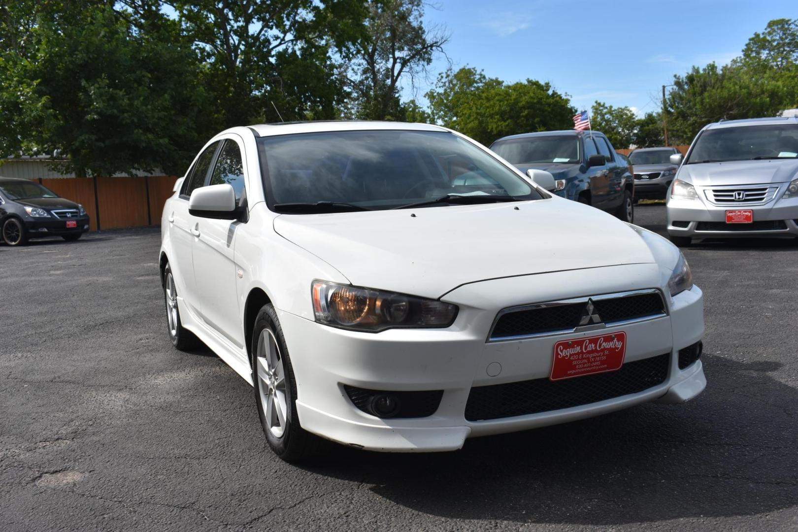 2009 WHITE /BLACK MITSUBISHI LANCER (JA3AU26U29U) with an 2.OL 4 CYLINDER engine, AUTOMATIC transmission, located at 420 E. Kingsbury St., Seguin, TX, 78155, (830) 401-0495, 29.581060, -97.961647 - Photo#0