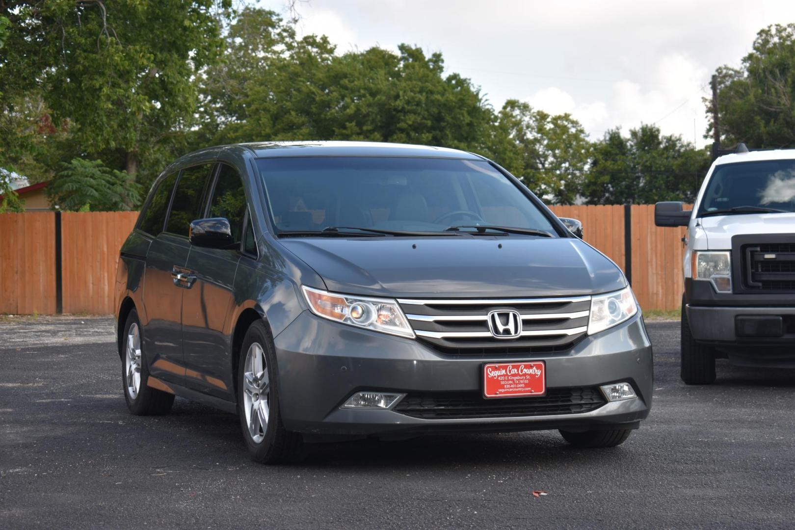 2012 Honda Odyssey Touring (5FNRL5H96CB) with an 3.5L V6 SOHC 24V engine, 5-Speed Automatic transmission, located at 420 E. Kingsbury St., Seguin, TX, 78155, (830) 401-0495, 29.581060, -97.961647 - Photo#0