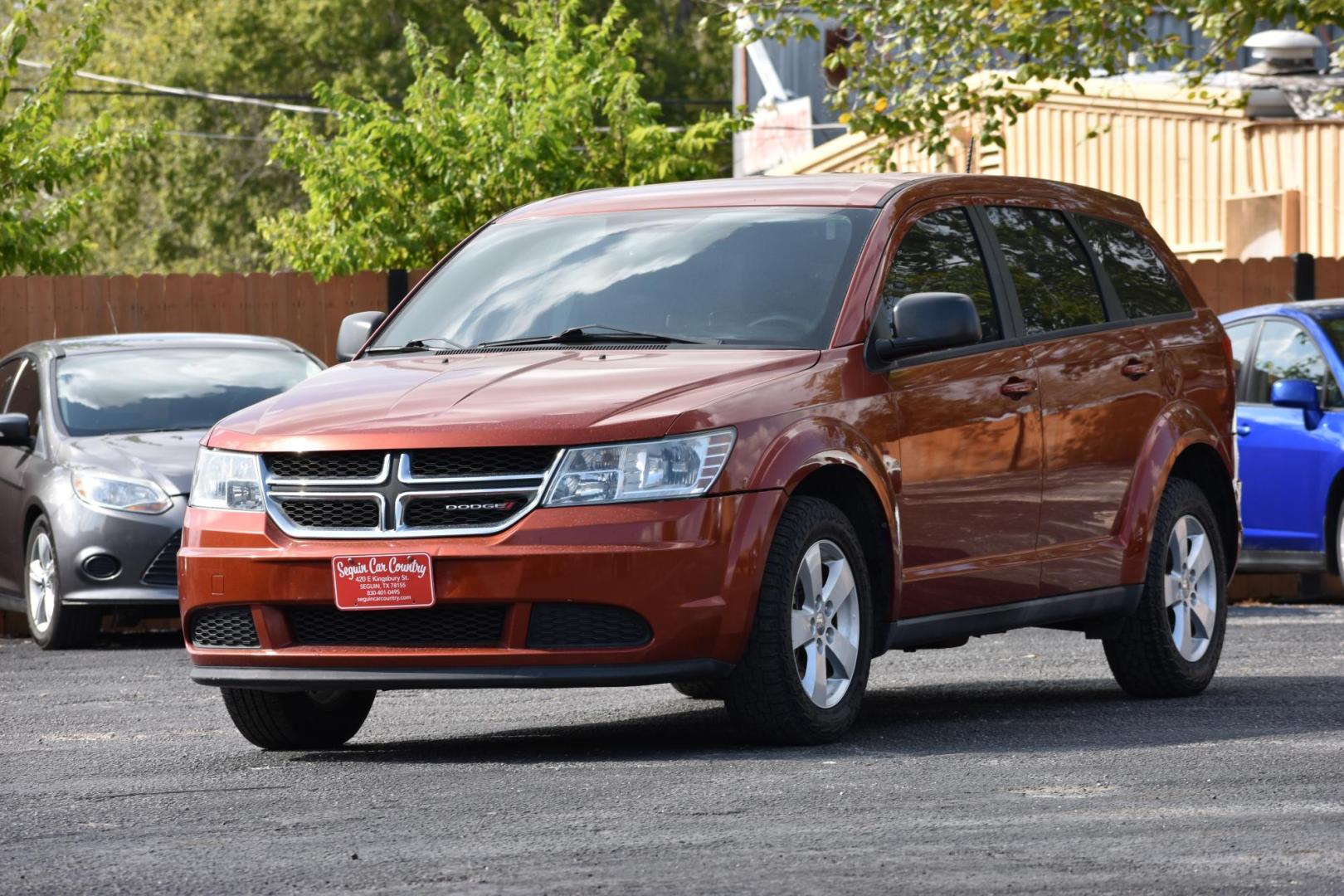 2013 ORANGE Dodge Journey SE (3C4PDCABXDT) with an 2.4L L4 DOHC 16V engine, 4-Speed Automatic transmission, located at 420 E. Kingsbury St., Seguin, TX, 78155, (830) 401-0495, 29.581060, -97.961647 - Photo#1