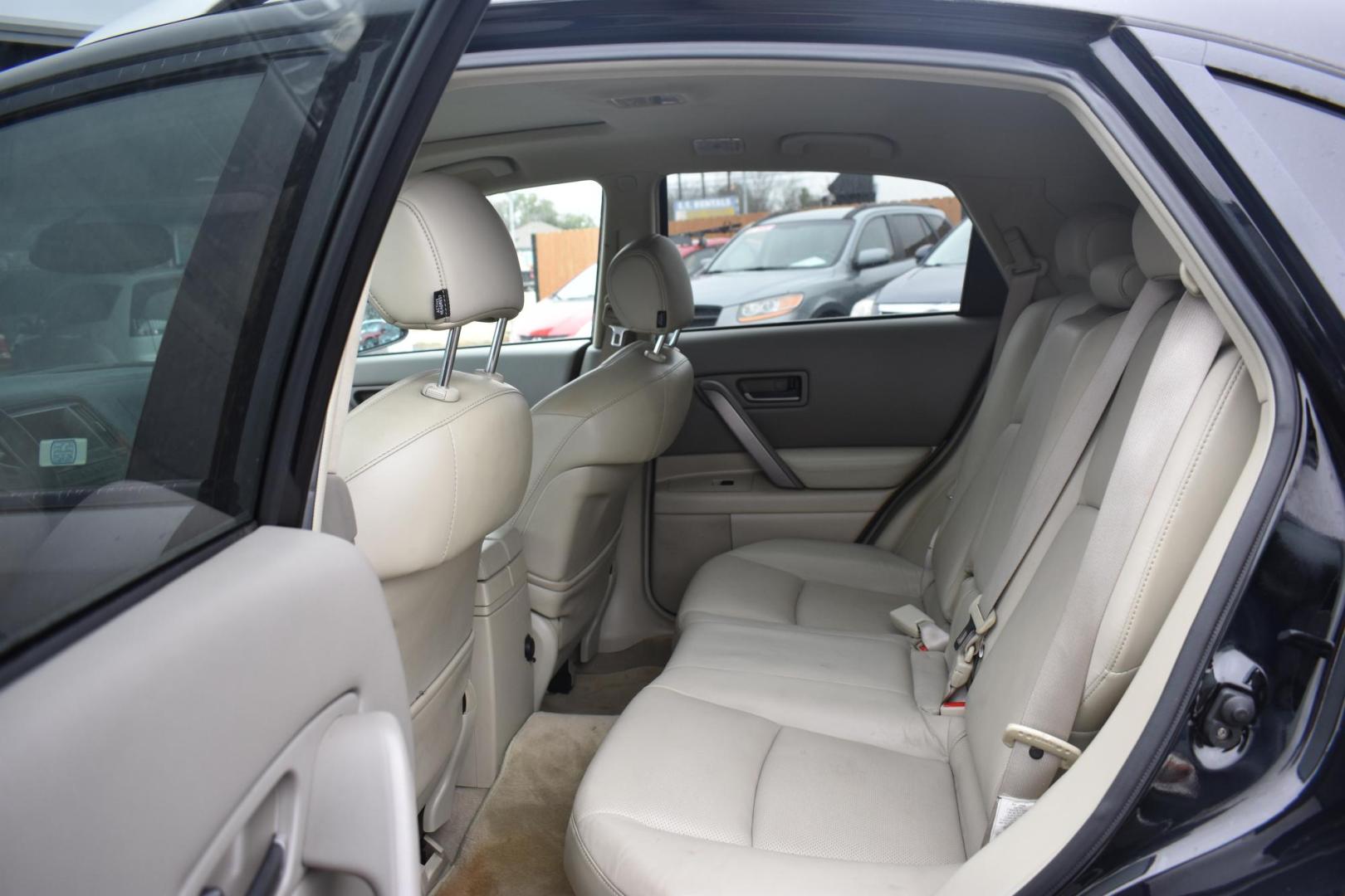 2004 BLACK Infiniti FX FX35 2WD (JNRAS08U94X) with an 3.5L V6 DOHC 32V engine, 5-Speed Automatic Overdrive transmission, located at 420 E. Kingsbury St., Seguin, TX, 78155, (830) 401-0495, 29.581060, -97.961647 - Photo#5